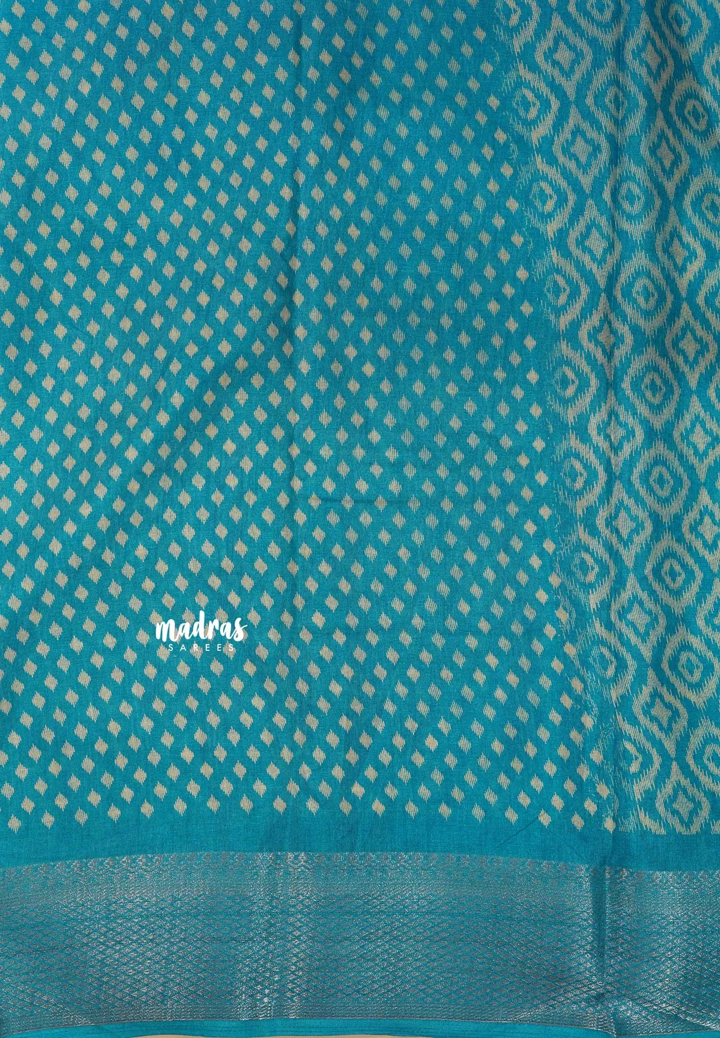 Teal Blue - Silky Georgette with Ikkat Prints and Zari Border
