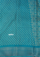 Teal Blue - Silky Georgette with Ikkat Prints and Zari Border