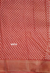 Muted Brick Red - Silky Georgette with Ikkat Prints and Zari Border