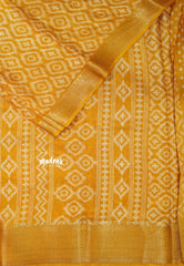 Turmeric Yellow - Silky Georgette with Ikkat Prints and Zari Border