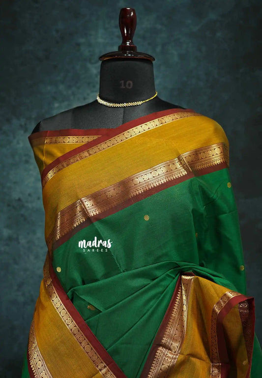 Green - vaibhogam 120 count Pure mercerized silk cotton with buttas and rettapet border