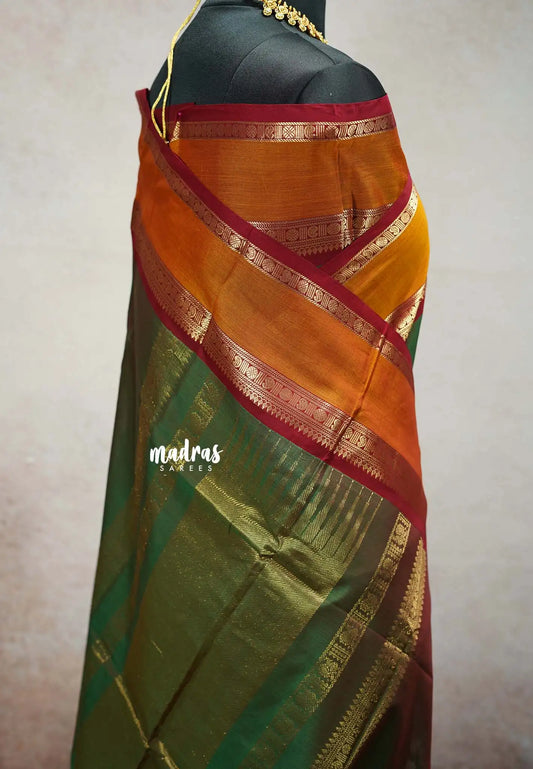 Dual shade Olive Green - vaibhogam 120 count Pure mercerized silk cotton with buttas and rettapet border