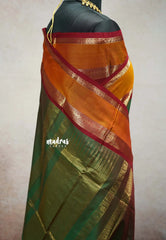 Dual shade Olive Green - vaibhogam 120 count Pure mercerized silk cotton with buttas and rettapet border