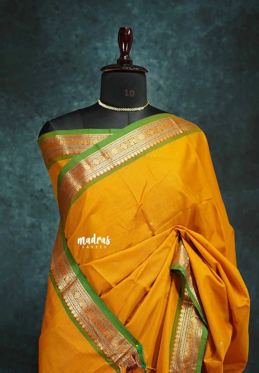 Turmeric yellow - vaibhogam 120 count Pure mercerized silk cotton small border with buttas