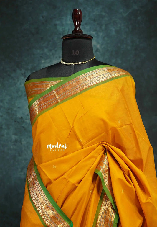 Turmeric yellow - vaibhogam 120 count Pure mercerized silk cotton small border with buttas